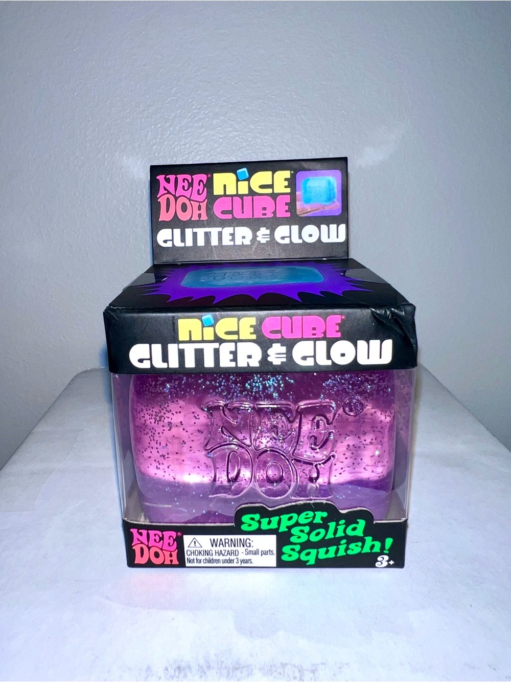 Neon purple NEEDOH Nice Cube Glitter & Glow Super Solid Squish